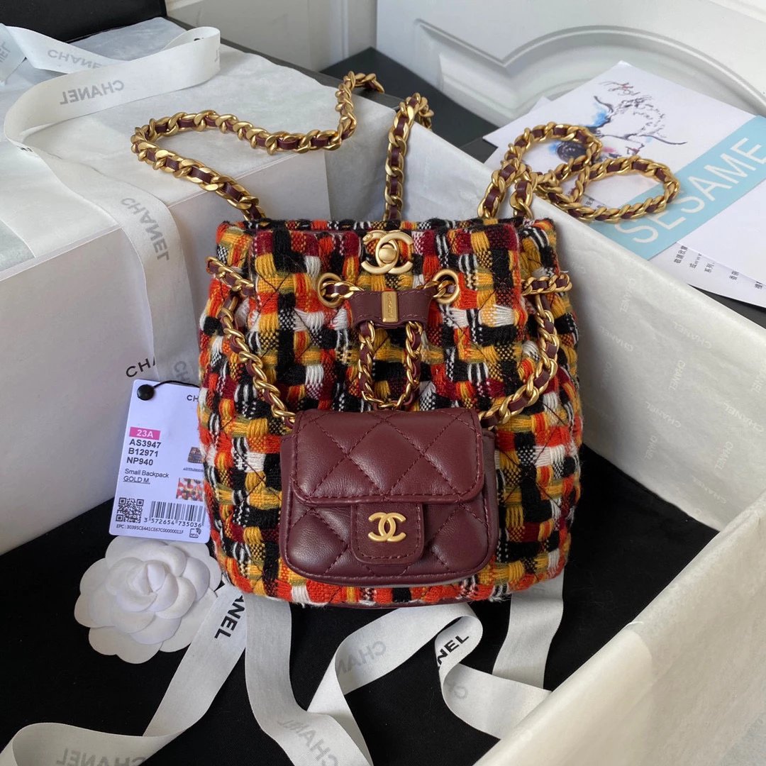 CHANEL 23A Quilted Chain Backpack in Wool Tweed