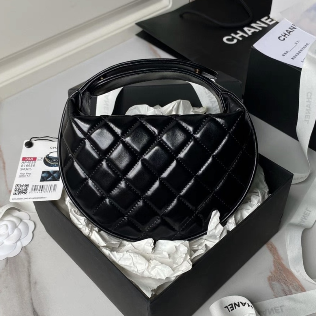 CHANEL Quilted Round Mini Black Top Handle Bag in Calfskin
