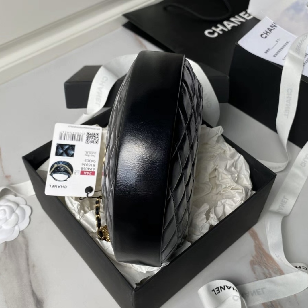 CHANEL Quilted Round Mini Black Top Handle Bag in Calfskin