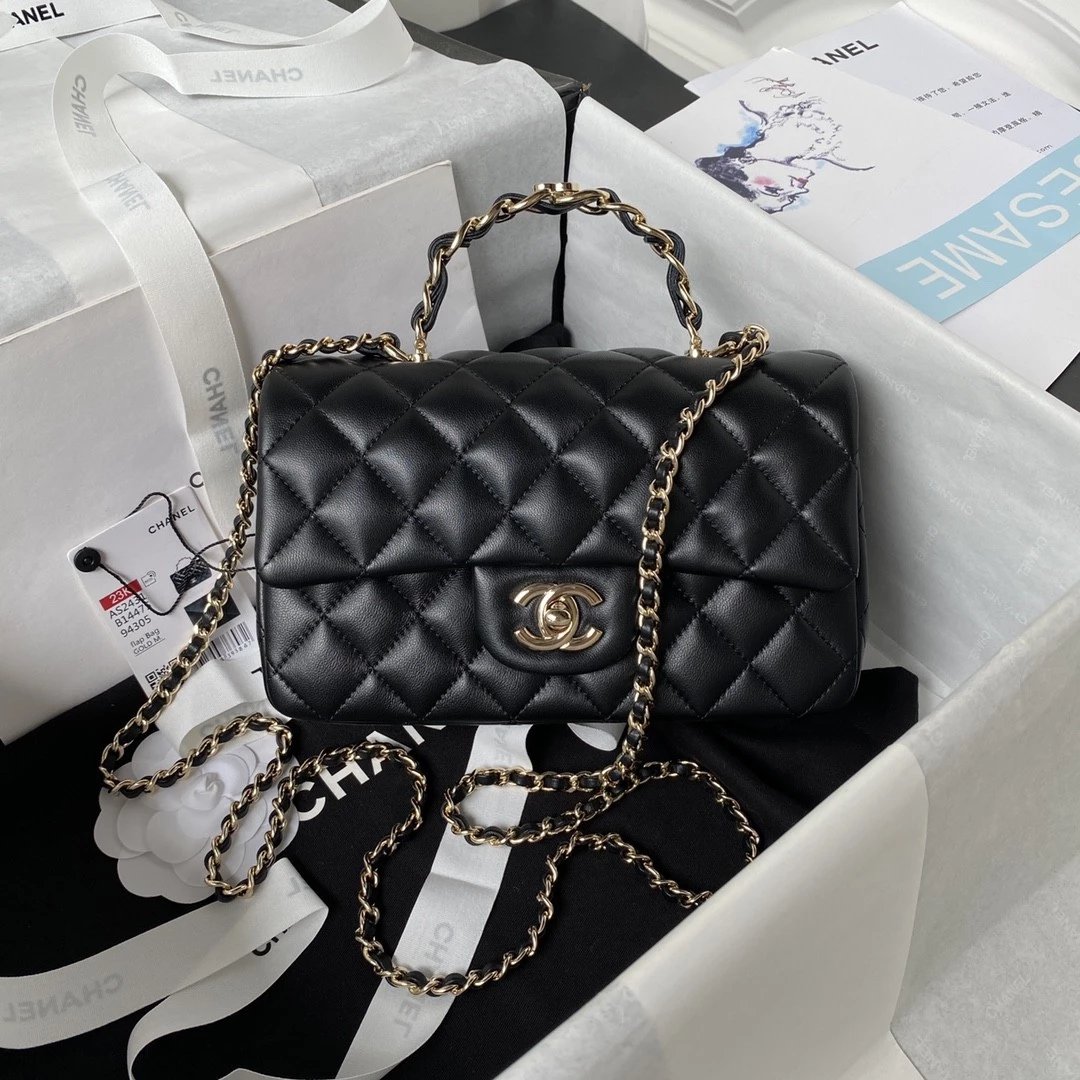 CHANEL Logo Handle bag in Lambskin
