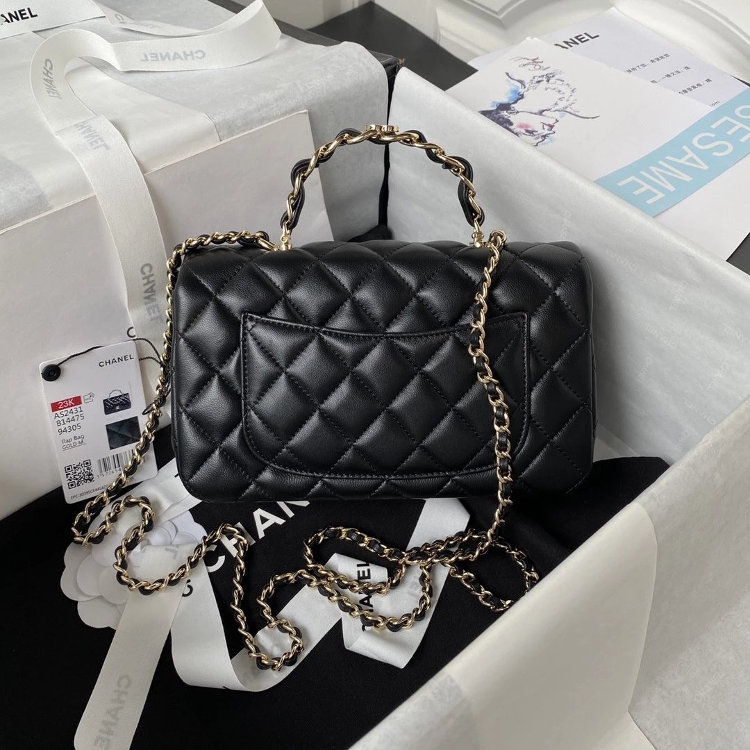 CHANEL Logo Handle bag in Lambskin