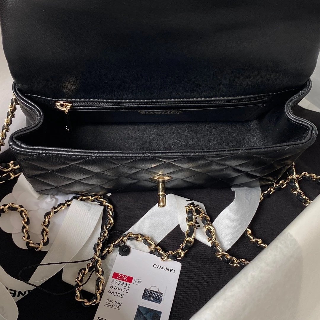 CHANEL Logo Handle bag in Lambskin
