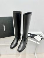 CHANEL riding boots with CC and chain at back