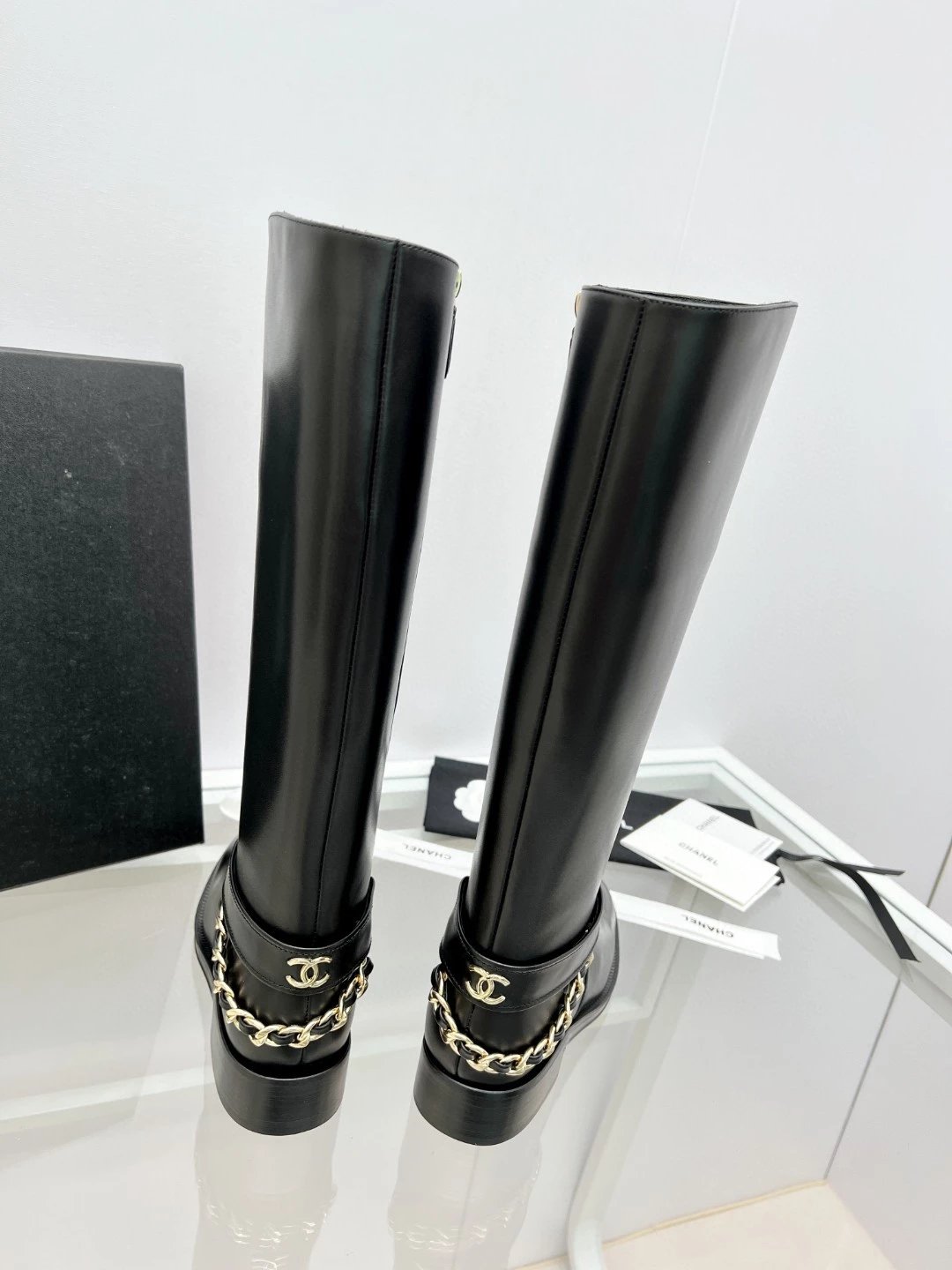 CHANEL riding boots with CC and chain at back