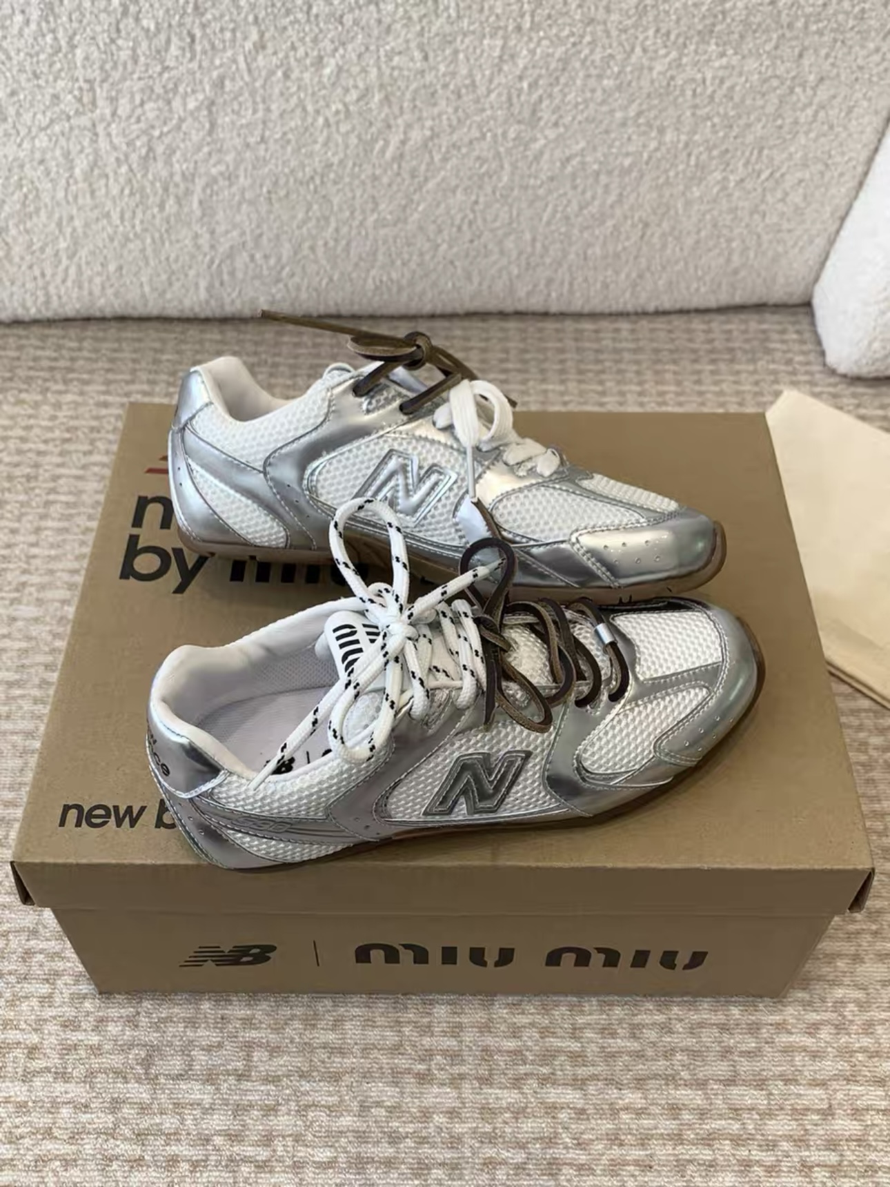 MIUMIU NB 530 SL metallic leather and mesh sneakers
