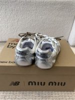 MIUMIU NB 530 SL metallic leather and mesh sneakers
